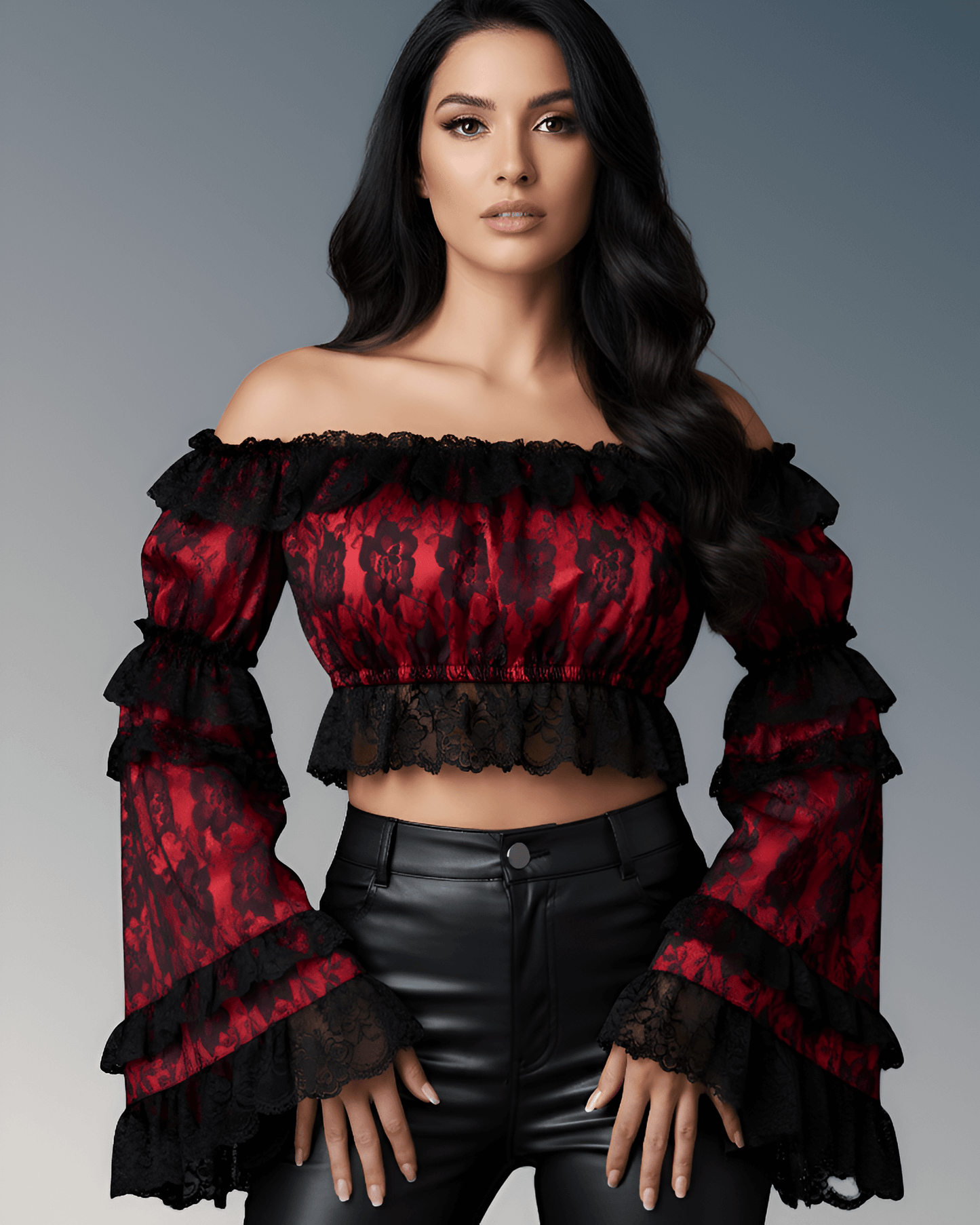 Woman wearing a red and black off-shoulder top with ruffled sleeves against a gray background
