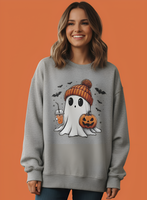 Woman wearing a gray sweatshirt with a Halloween-themed ghost design on an orange background