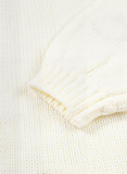 Close-up of a textured white fabric with a subtle pattern