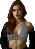 Woman wearing a gray bralette with a white background