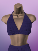 Purple crochet top on a mannequin against a purple background