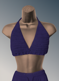 Purple crochet top on a mannequin against a gray background