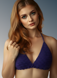 Woman wearing a purple crochet bikini top against a gray background