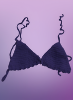 Purple bikini top on a purple background