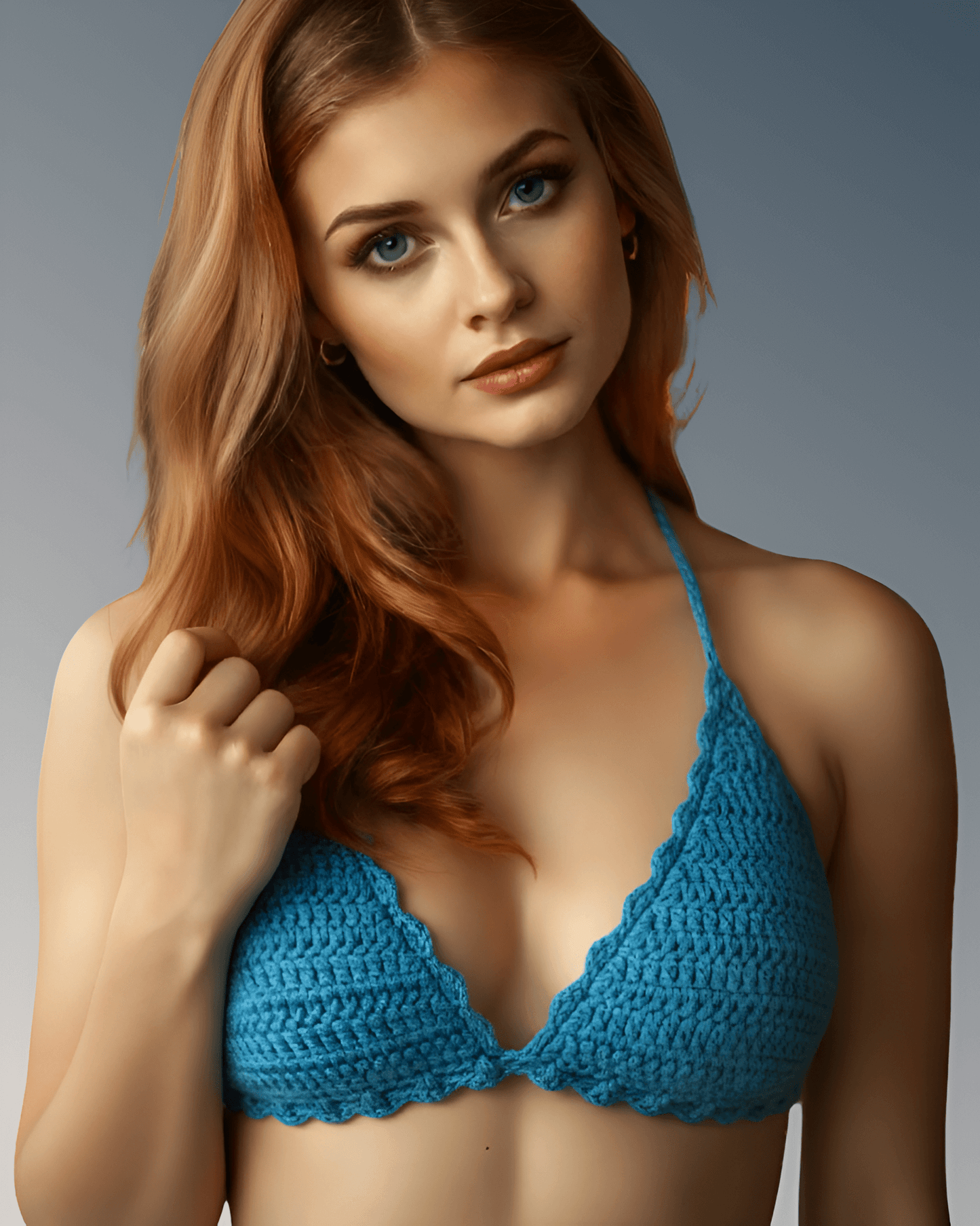 Woman wearing a blue crochet bikini top against a gray background