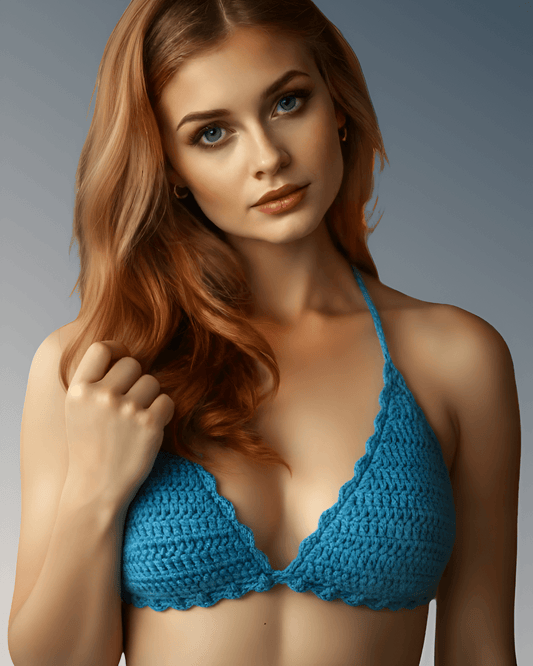Woman wearing a blue crochet bikini top against a gray background