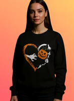 Person wearing a black sweatshirt with Halloween-themed design on an orange background