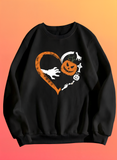 Black sweatshirt with Halloween-themed design on an orange background