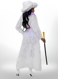 Person wearing a long white textured dress with a hood, holding a cane on a white background