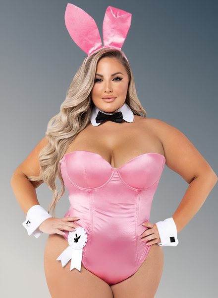 Person wearing a pink bunny costume with ears and a bodysuit on a gray background