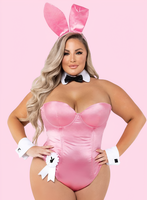 Person wearing a pink bunny costume with ears on a pink background