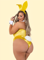 Person wearing a yellow bunny costume with a plain background