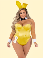 Person wearing a yellow bunny costume with ears on a beige background